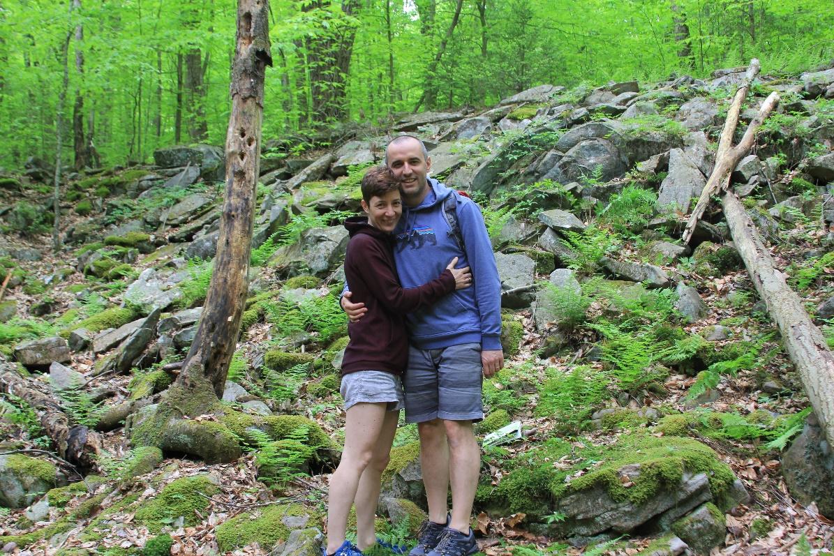 Krasi and her husband embracing on a hike